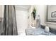 Cozy bathroom featuring a shower over tub, elegant gray countertop, and modern fixtures at 1105 San Remo Ln, Lady Lake, FL 32159