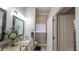 Bright bathroom featuring a toilet and double sinks with granite counters at 1105 San Remo Ln, Lady Lake, FL 32159