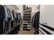 Bright closet featuring ample clothing storage, shoe rack, and built-in drawers at 1105 San Remo Ln, Lady Lake, FL 32159