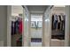 Dual closets featuring ample storage, shelving, and access to the primary bathroom at 1105 San Remo Ln, Lady Lake, FL 32159