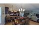 Open floor plan with the dining room adjacent to the kitchen and living room at 1105 San Remo Ln, Lady Lake, FL 32159