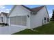 Charming home featuring a well-manicured lawn and a convenient two-car garage at 1105 San Remo Ln, Lady Lake, FL 32159