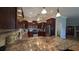 Spacious kitchen featuring modern appliances, granite counters, and ample cabinet space at 1105 San Remo Ln, Lady Lake, FL 32159