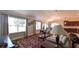 Cozy living room featuring hardwood floors, an area rug, and lots of natural light at 1105 San Remo Ln, Lady Lake, FL 32159