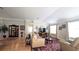 Spacious living room featuring hardwood floors, a display cabinet, and an area rug at 1105 San Remo Ln, Lady Lake, FL 32159