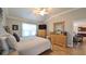 Spacious main bedroom with hardwood floors, ceiling fan, and access to the living area at 1105 San Remo Ln, Lady Lake, FL 32159