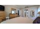 Main bedroom with hardwood floors, access to bathroom, and spacious design at 1105 San Remo Ln, Lady Lake, FL 32159