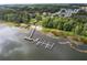 Beautiful overhead view of the lake, community beach, and pier at 11926 Milan Way, Leesburg, FL 34788