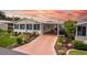 Well-maintained single-story home with a covered carport and lovely landscaped front yard at 11926 Milan Way, Leesburg, FL 34788