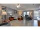 Comfortable living room with cozy furniture, neutral tones, and bright natural light at 11926 Milan Way, Leesburg, FL 34788
