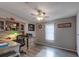 Home office with built-in shelving and plenty of natural light at 11926 Milan Way, Leesburg, FL 34788
