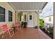 Outdoor patio area with seating, plants and a grill at 11926 Milan Way, Leesburg, FL 34788