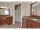Bathroom featuring dual vanities, large mirrors, and tiled flooring at 1325 Otters View Ct, Fruitland Park, FL 34731