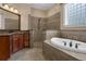 Main bathroom features a walk-in shower and relaxing soaking tub at 1325 Otters View Ct, Fruitland Park, FL 34731