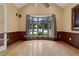 Bright bedroom with bay window, hardwood floors, and a ceiling fan at 1325 Otters View Ct, Fruitland Park, FL 34731