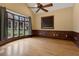 Cozy bedroom with a bay window, hardwood floors, and a ceiling fan at 1325 Otters View Ct, Fruitland Park, FL 34731