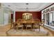 Elegant dining room showcasing hardwood floors, a dining table, and a decorative hutch at 1325 Otters View Ct, Fruitland Park, FL 34731