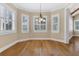 Bright dining room with large windows, plantation shutters and hardwood floors at 1325 Otters View Ct, Fruitland Park, FL 34731