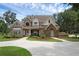 Charming two-story home with landscaped yard and inviting front entrance on a sunny day at 1325 Otters View Ct, Fruitland Park, FL 34731