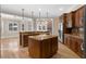 An open concept kitchen with islands, stainless steel appliances, and plenty of cabinet space at 1325 Otters View Ct, Fruitland Park, FL 34731