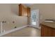 Functional laundry room with cabinetry and sink at 1325 Otters View Ct, Fruitland Park, FL 34731