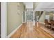 Spacious living room with tall windows, hardwood floors, staircase, and ample natural light at 1325 Otters View Ct, Fruitland Park, FL 34731