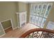 View of the living room from the upper level, highlighting the fireplace and pool view at 1325 Otters View Ct, Fruitland Park, FL 34731