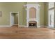 A cozy living room features a fireplace and leads to other areas of the home at 1325 Otters View Ct, Fruitland Park, FL 34731
