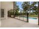 A backyard swimming pool and patio with beautiful landscaping at 1325 Otters View Ct, Fruitland Park, FL 34731