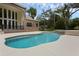 Backyard swimming pool and spa with brick home in the background at 1325 Otters View Ct, Fruitland Park, FL 34731