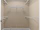 Functional walk-in closet featuring multiple white wire shelving units for optimal storage and organization at 1325 Otters View Ct, Fruitland Park, FL 34731