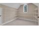 A large walk-in closet features built-in shelving and a window for natural light at 1325 Otters View Ct, Fruitland Park, FL 34731