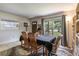 Cozy dining room with natural light, comfortable seating, and stylish decor at 1415 Braebury Dr, Leesburg, FL 34748