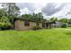 Exterior view of a single Gathering home, featuring a well-kept lawn at 1415 Braebury Dr, Leesburg, FL 34748