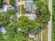A high angle view of several properties with lush landscaping and private pools at 1511 W Magnolia St, Clermont, FL 34711