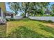 Expansive backyard with lush lawn and privacy fence at 1511 W Magnolia St, Clermont, FL 34711