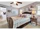 Bedroom with a large bed and bedside tables, accented with floral patterns and soft lighting at 1511 W Magnolia St, Clermont, FL 34711