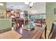 Dining area with a view of the kitchen and living room featuring tile floors at 1511 W Magnolia St, Clermont, FL 34711