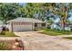 Attractive one-story home featuring an attached two-car garage and landscaped front yard at 1511 W Magnolia St, Clermont, FL 34711