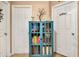 Hallway with a display case featuring books and decor, with access to two rooms at 1511 W Magnolia St, Clermont, FL 34711