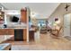 Open living room with tiled floors, view of the kitchen, and lots of natural light at 1511 W Magnolia St, Clermont, FL 34711