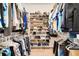 Walk-in closet with organized shelving and ample space for clothing and shoes at 15629 Catherine Cir, Groveland, FL 34736