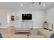 Living room featuring a media center, hardwood floors, and modern furnishings at 15629 Catherine Cir, Groveland, FL 34736