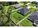 Aerial view of a fenced backyard with a trampoline on a well maintained lawn at 1620 6Th Ave, Deland, FL 32724
