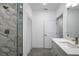 Bathroom features a shower with marble-look tile and a sleek, modern vanity at 1620 6Th Ave, Deland, FL 32724