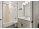 Bathroom features a tub with shower and a gray vanity with modern lighting at 1620 6Th Ave, Deland, FL 32724
