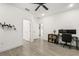 Well lit bedroom with wood look tile flooring and a modern ceiling fan at 1620 6Th Ave, Deland, FL 32724