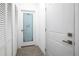 Hallway featuring doors to a closet and laundry room with a decorative glass door at 1620 6Th Ave, Deland, FL 32724