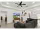 Bright living room features recessed lighting, ceiling fan, and comfortable sectional sofa for relaxing and watching TV at 1620 6Th Ave, Deland, FL 32724