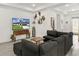 Bright living room features recessed lighting, ceiling fan, and comfortable sectional sofa for relaxing and watching TV at 1620 6Th Ave, Deland, FL 32724